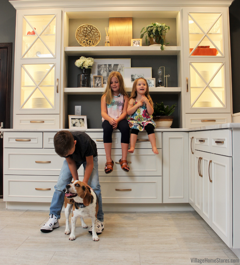 Kids and family dog at custom hutch area in new kitchen from kitchen designers Village Home Stores in Geneseo Illinois.