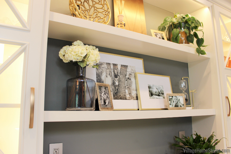 Styled open shelves with frames and decor