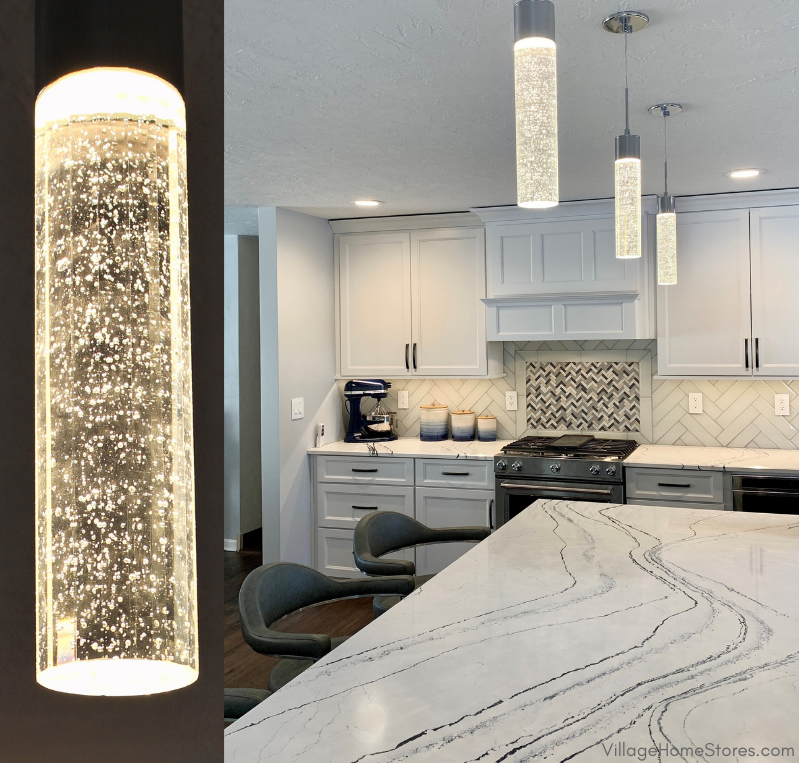 Kitchen island pendants that are acrylic bubble cylinders with LED lighting