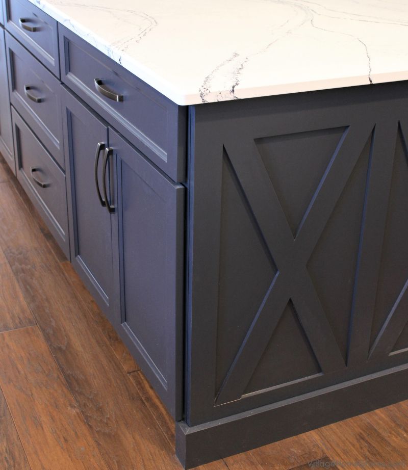 Corner of a kitchen island with Charcoal Blue painted cabinetry and X design on end cap