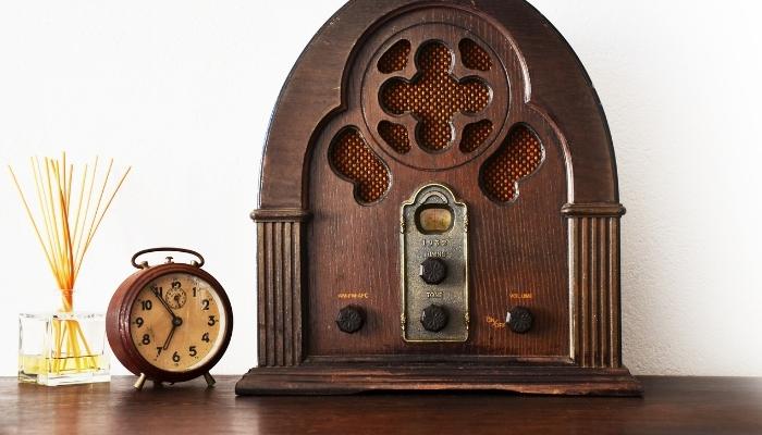 Vintage radio next to clock