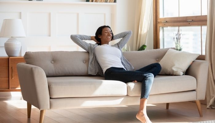 woman relaxing on couch