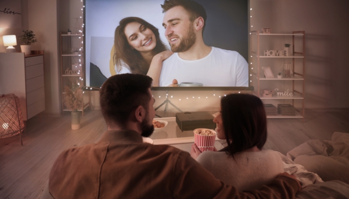 Couple watching movie on a short throw projector