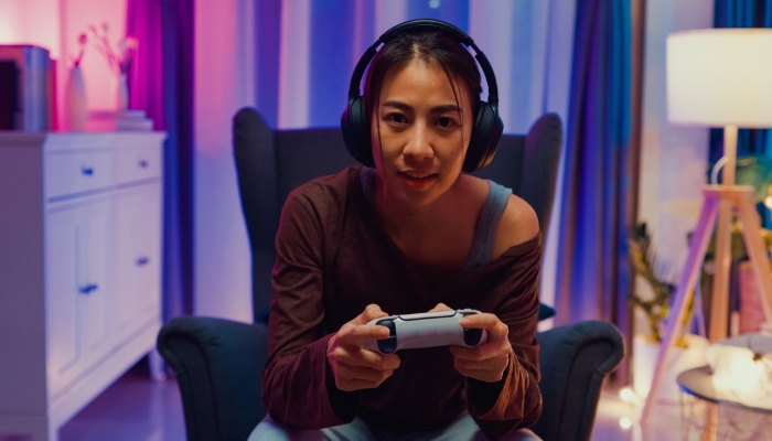 Woman gaming with a headset on