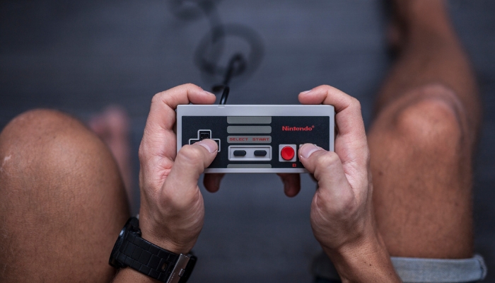 Closeup of a man playing vintage NES
