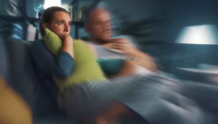Blurry picture of couple watching intense movie