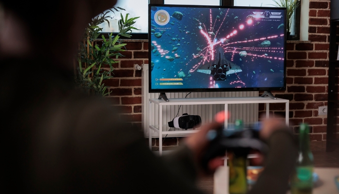 Closeup of someone playing on a large flatscreen TV