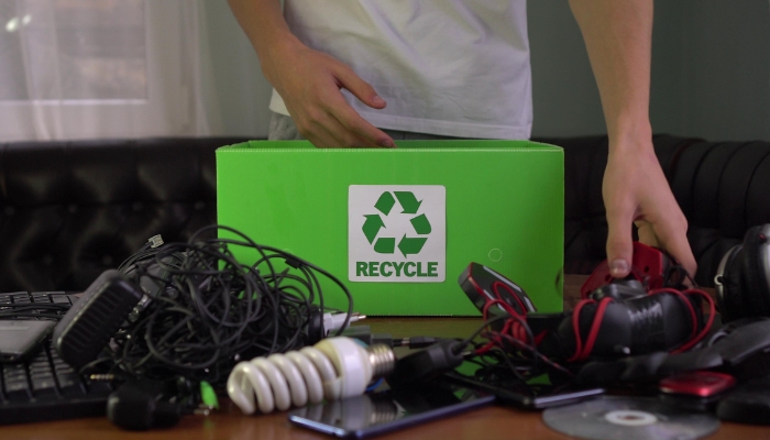 Person collecting electronics to recycle