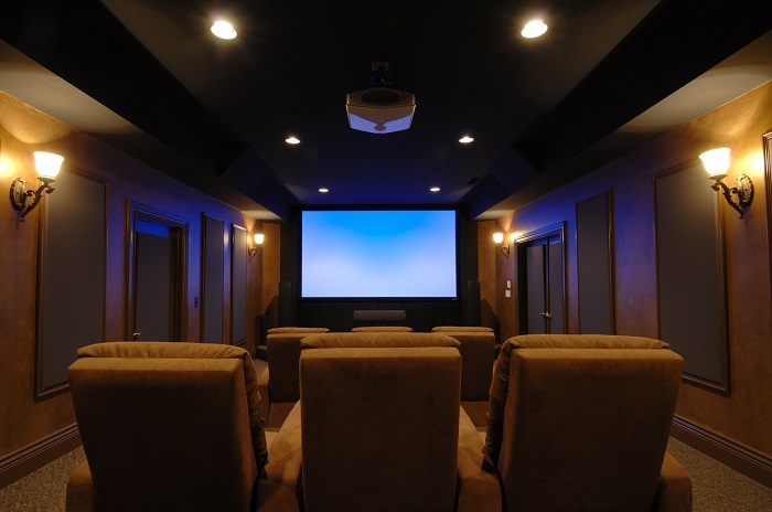 High end home theatre with upper lighting and projector.