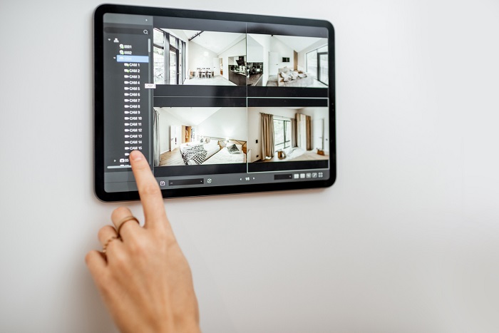 Controlling home with video cameras and digital tablet.