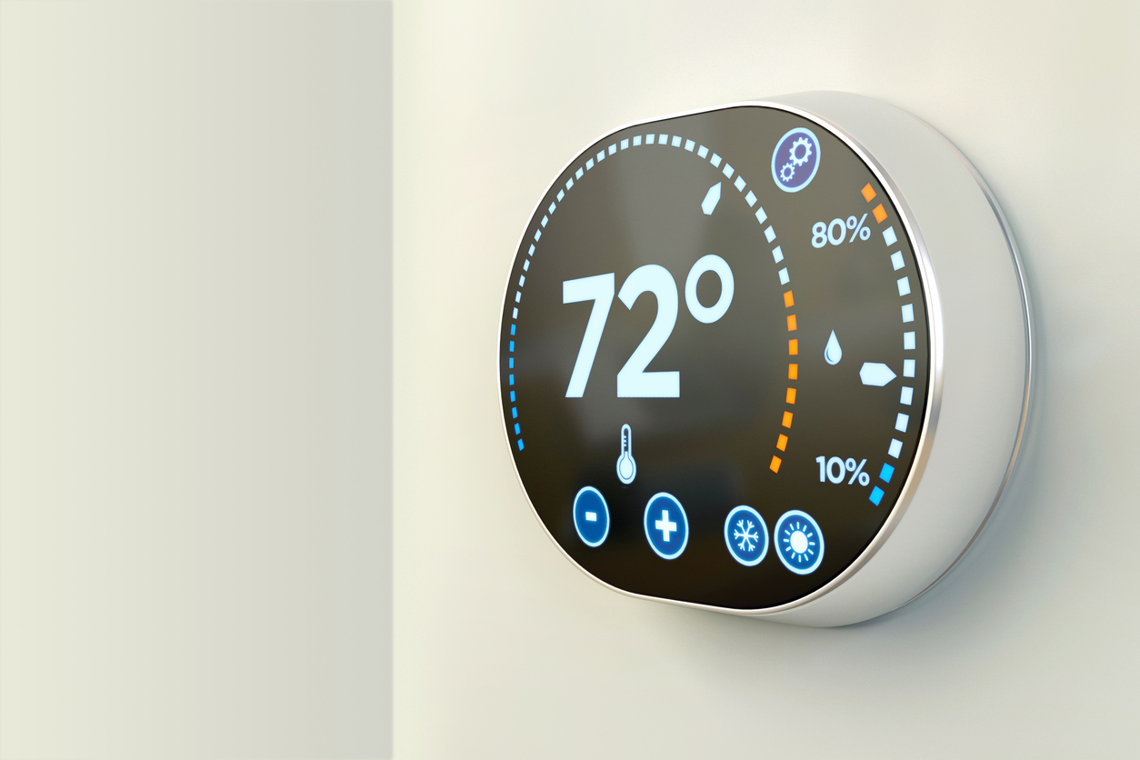 smart thermostat mounted on wall in home
