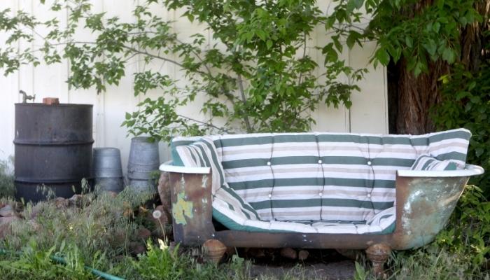 Repurposed vintage bathtub into patio seating