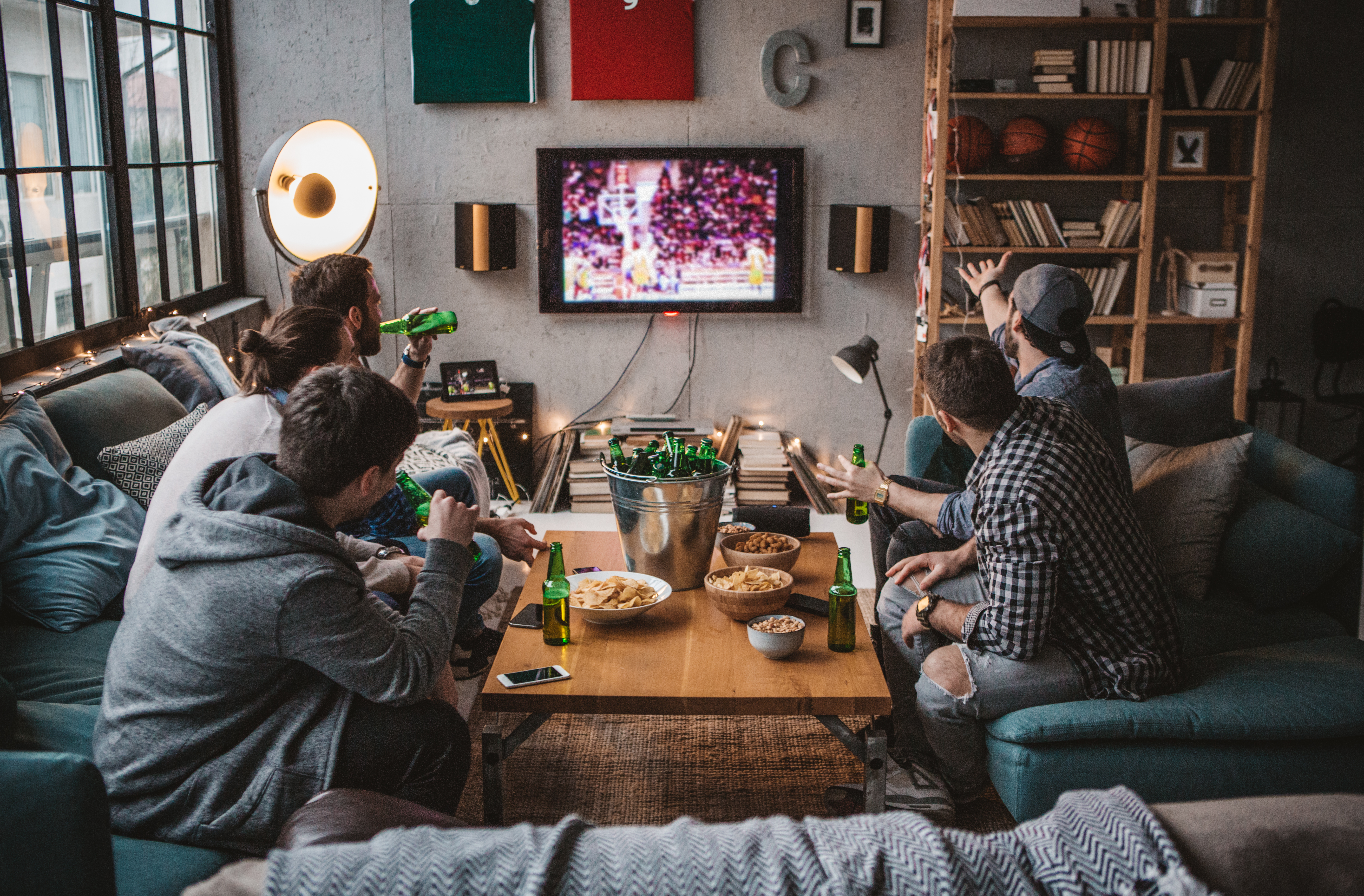 group of men hanging out in a man cave
