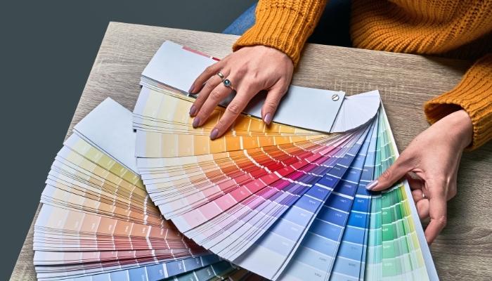 Woman looking at different color palettes