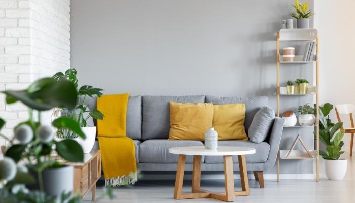 https://d12mivgeuoigbq.cloudfront.net/assets/blog/blog_furniture/Q4_2022/Furn_Decorate-Around-Grey-Couch_4.jpg