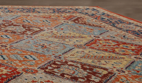 Close up of oriental style rug in warm colors