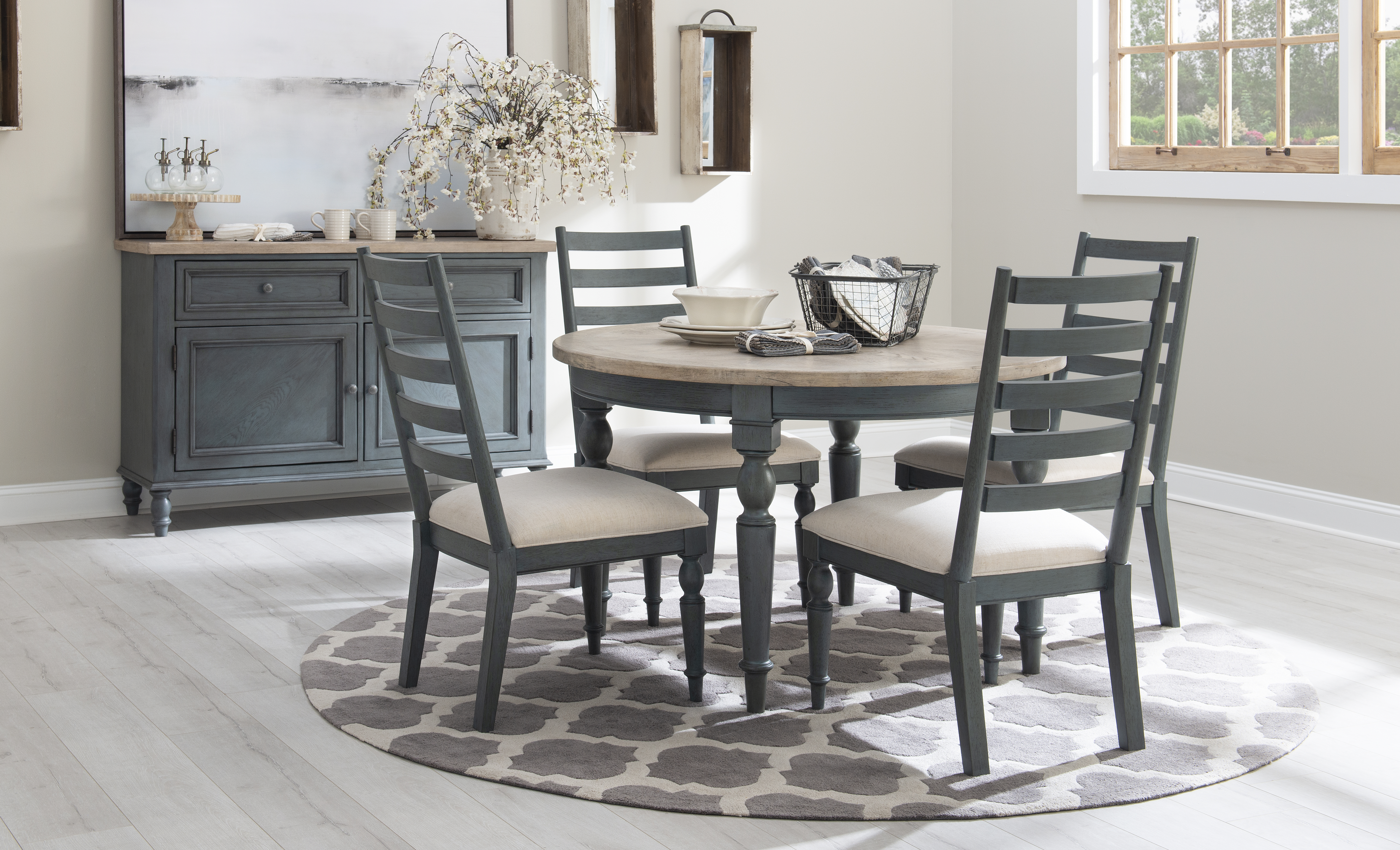 A dining room featuring the Legacy Classic Furniture High Line by Rachael Ray table and dining room set 