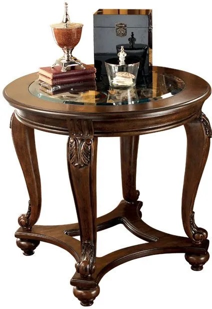 Signature Design by Ashley Norcastle traditional-style end table shown staged with décor and figurines