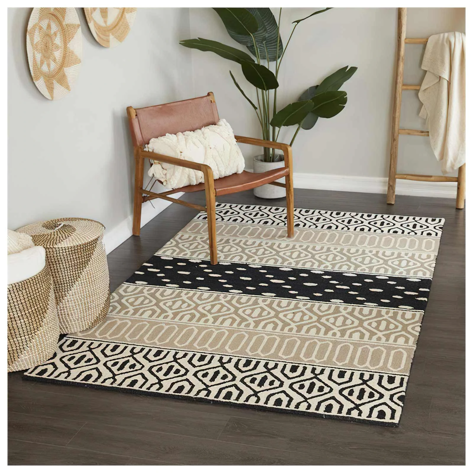 The UMA Enterprise area rug shown with a matching chair and décor 