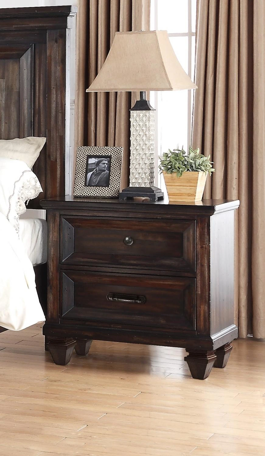 The New Classic Furniture Sevilla nightstand in a bedroom 
