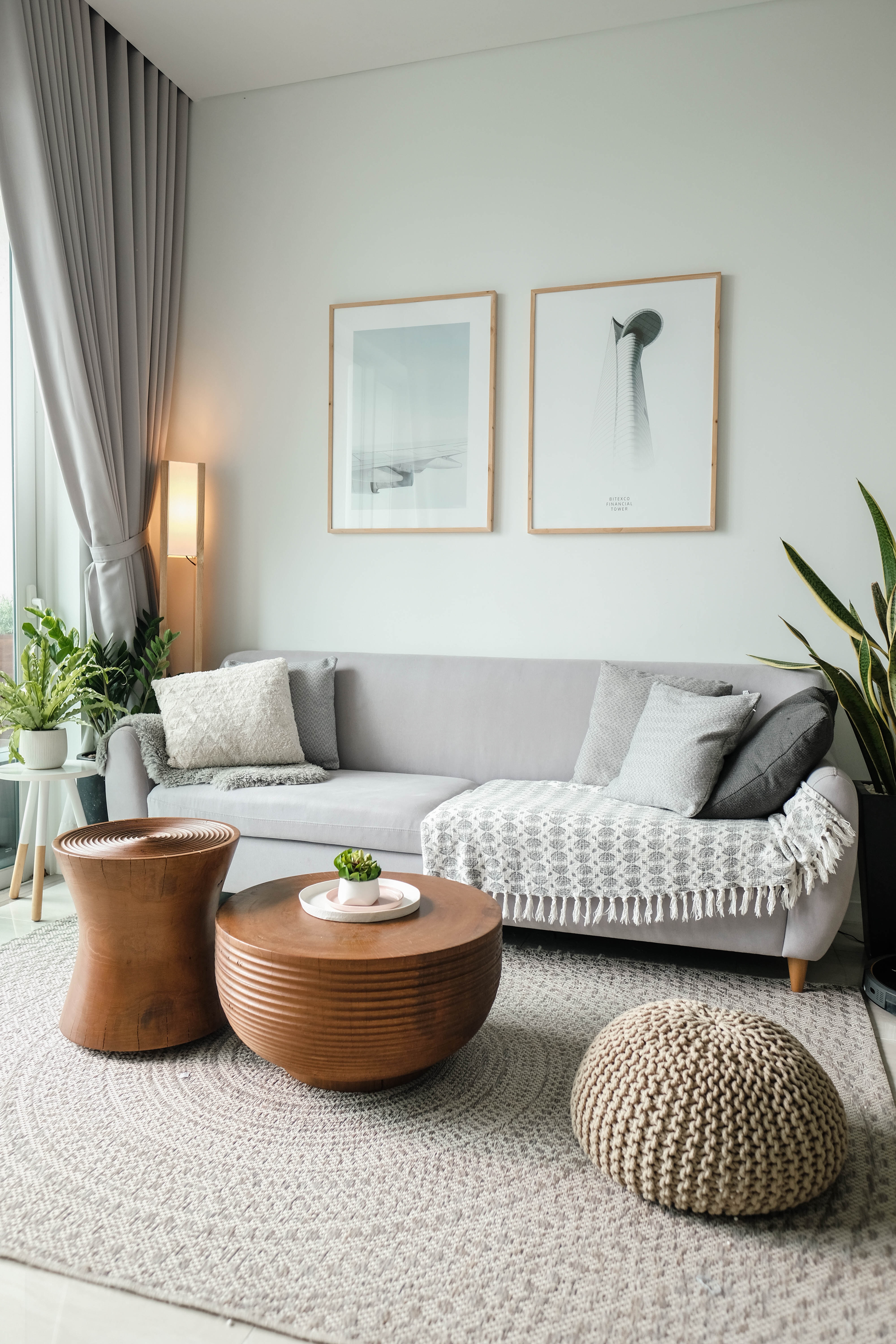 Light grey sofa in a living room with natural elements and textured details