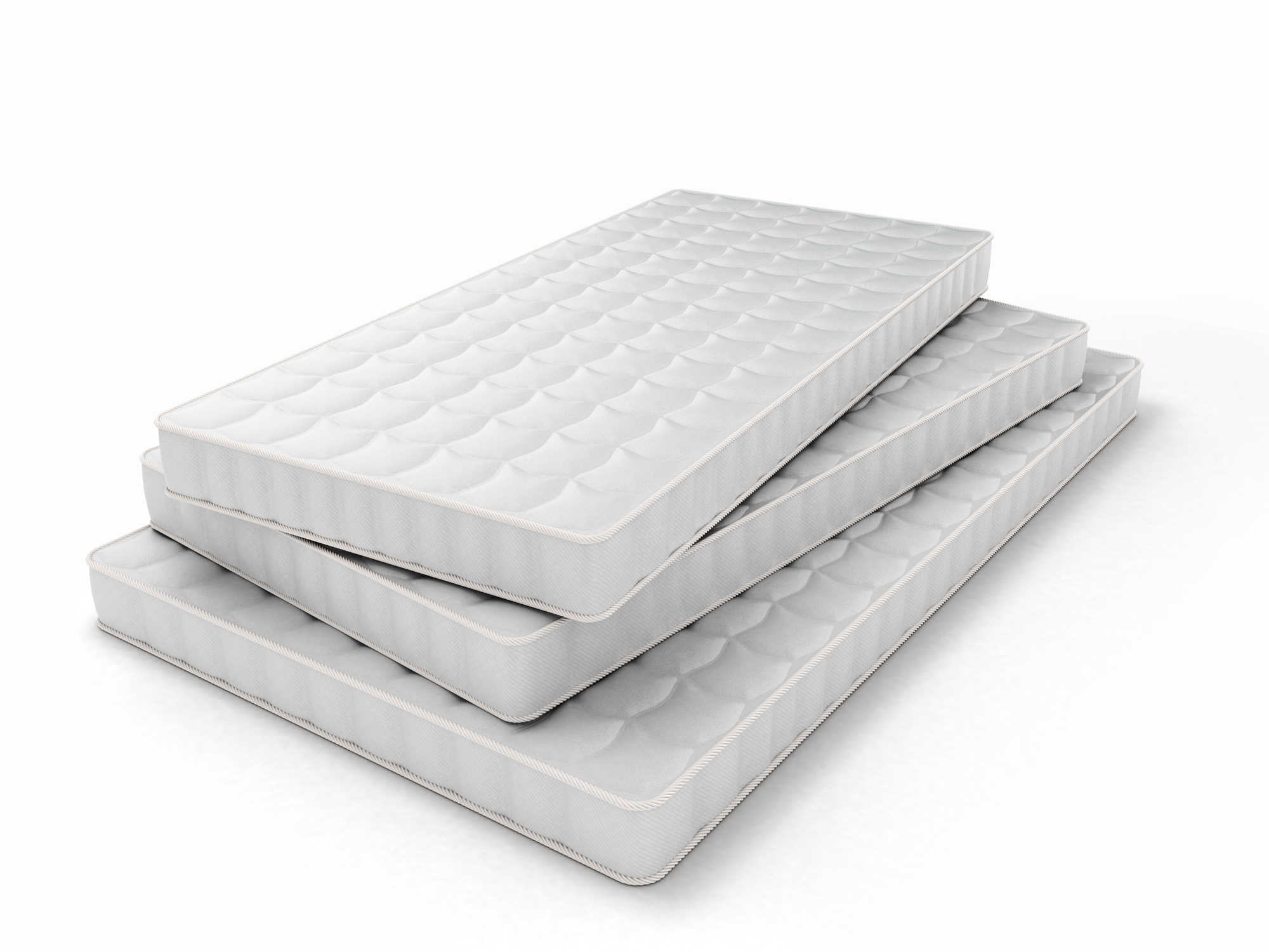stack of mattresses in various sizes