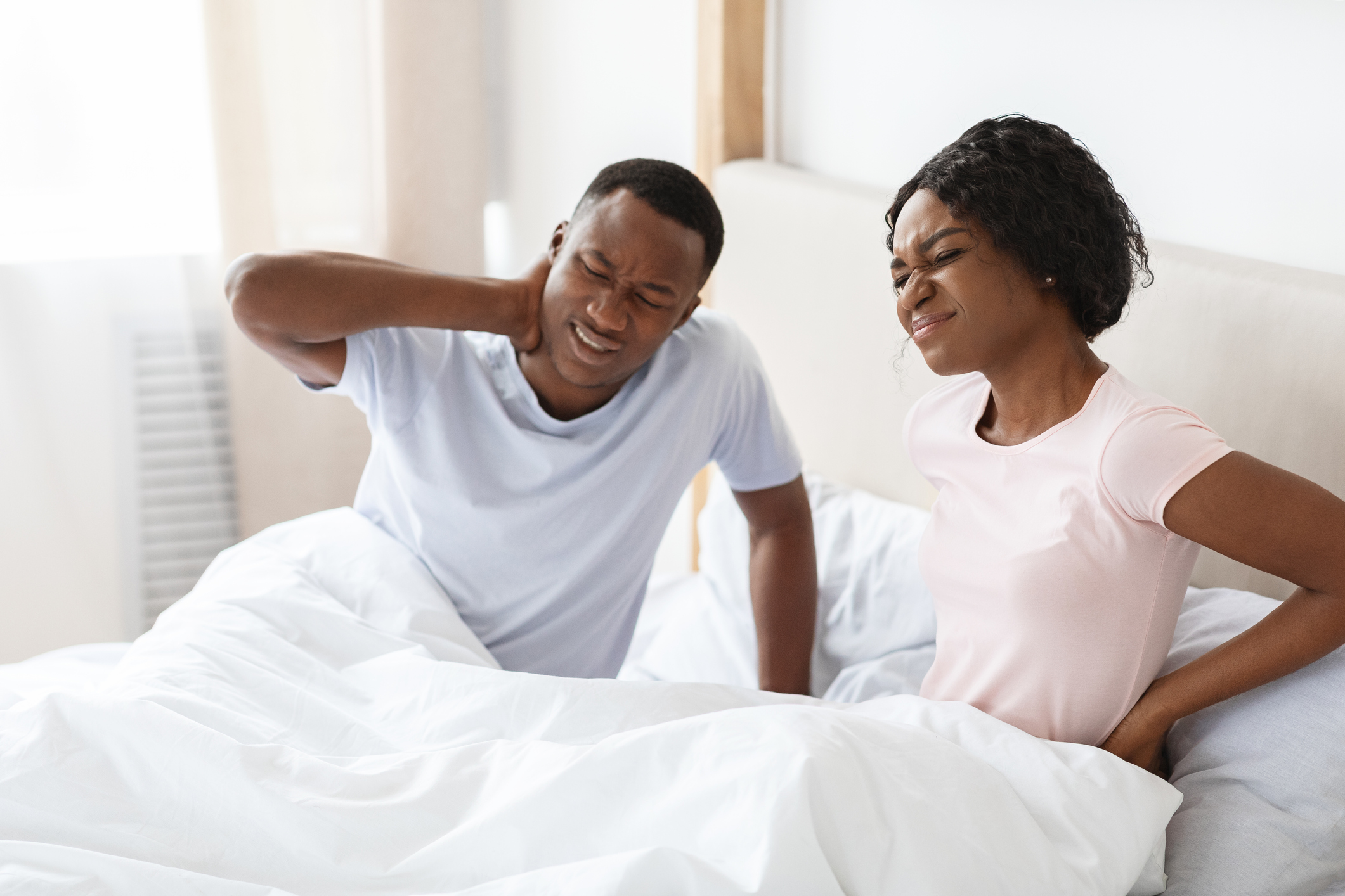 couple with body aches from bad mattress