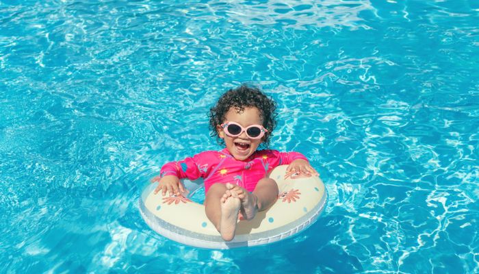 little girl having fun in pool