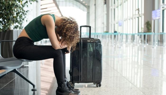 woman tired and waiting on flight