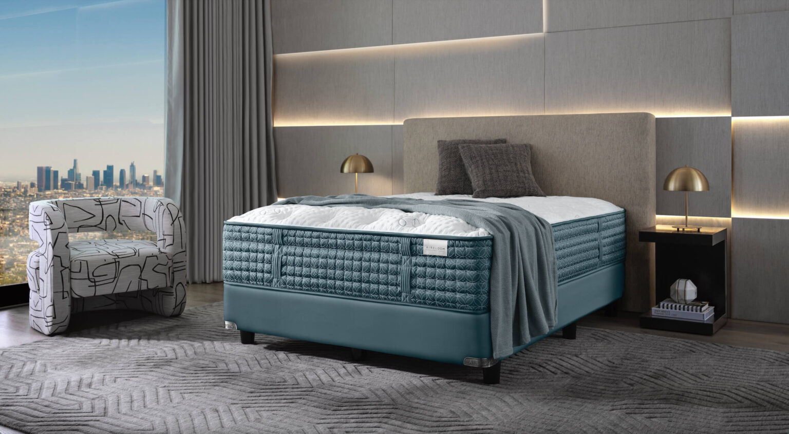 Aireloom mattress displayed in a high-end apartment overlooking a city. 