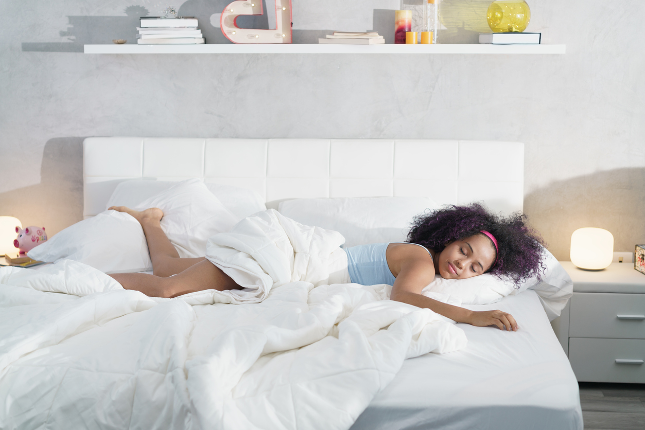 woman restfully sleeping in bed