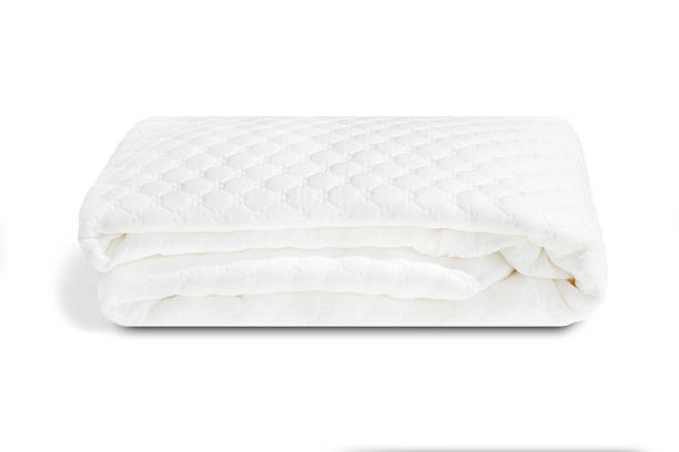 white folded mattress pad