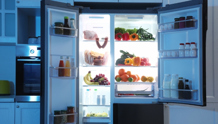 An open fridge showing well-organized interior