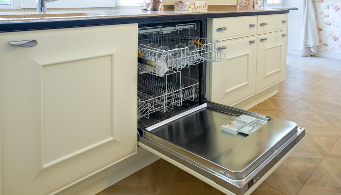 Side view of an open and empty dishwasher