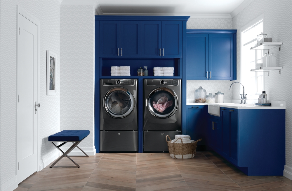 built-in laundry pair with blue cabinetry