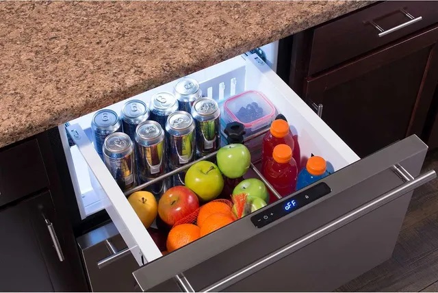 Marvel refrigerator drawer with an assortment of beverages and fruits inside