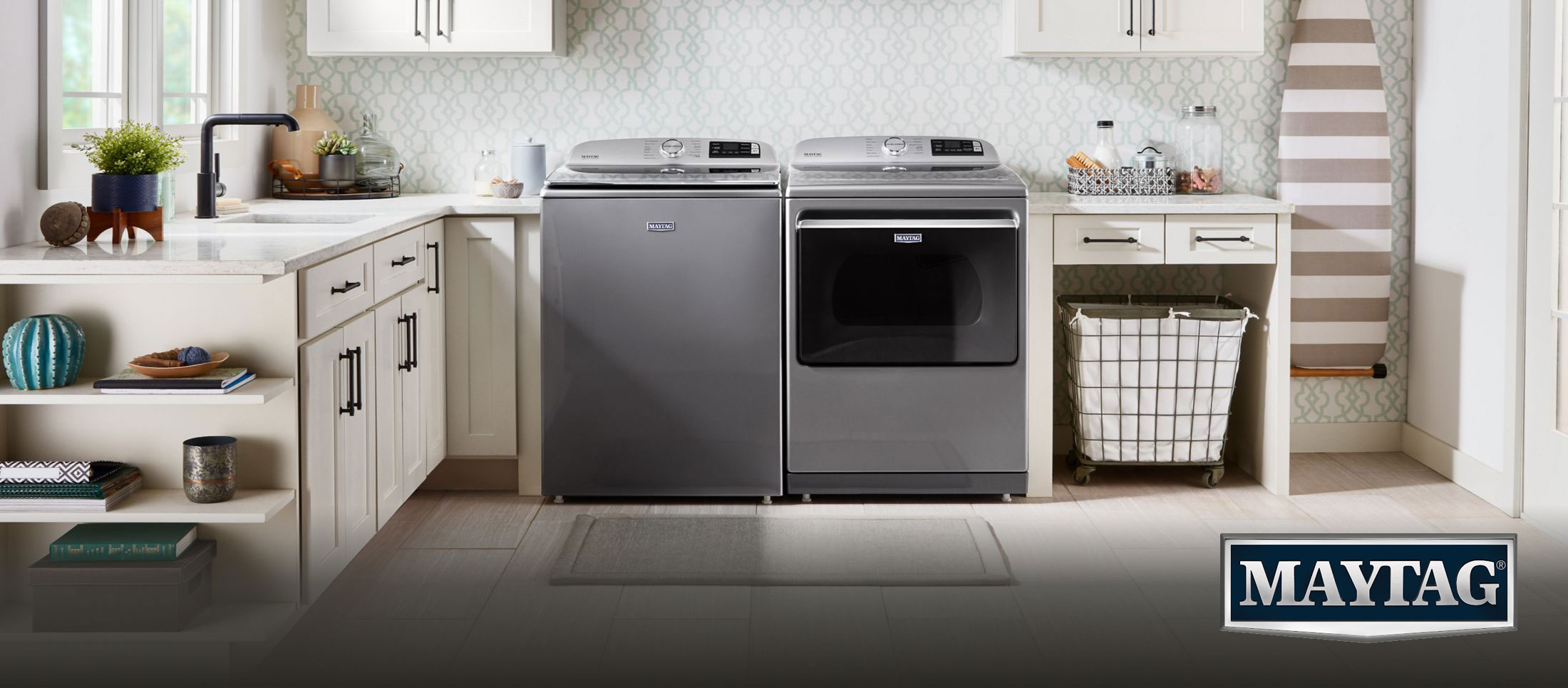 Maytag top-load washer and front-load dryer in designer laundry room