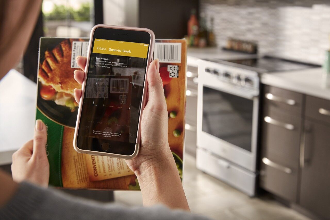 Person using smart device for the Scan-to-Cook function on Whirlpool oven