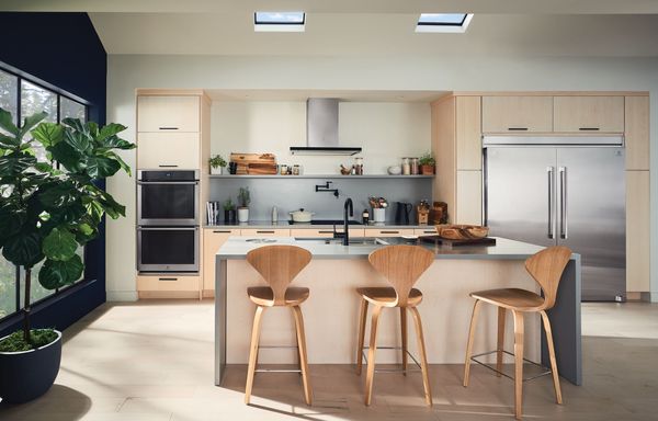 Stainless steel appliances in a modern, minimalist kitchen