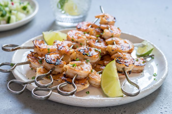 grilled cilantro-lime shrimp skewers served on a plate