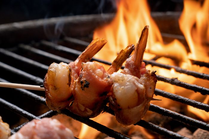 bacon-wrapped jumbo shrimp over a fired-up grill