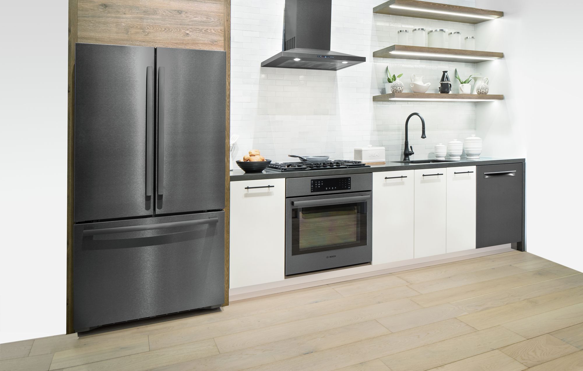 White kitchen with store black stainless appliances