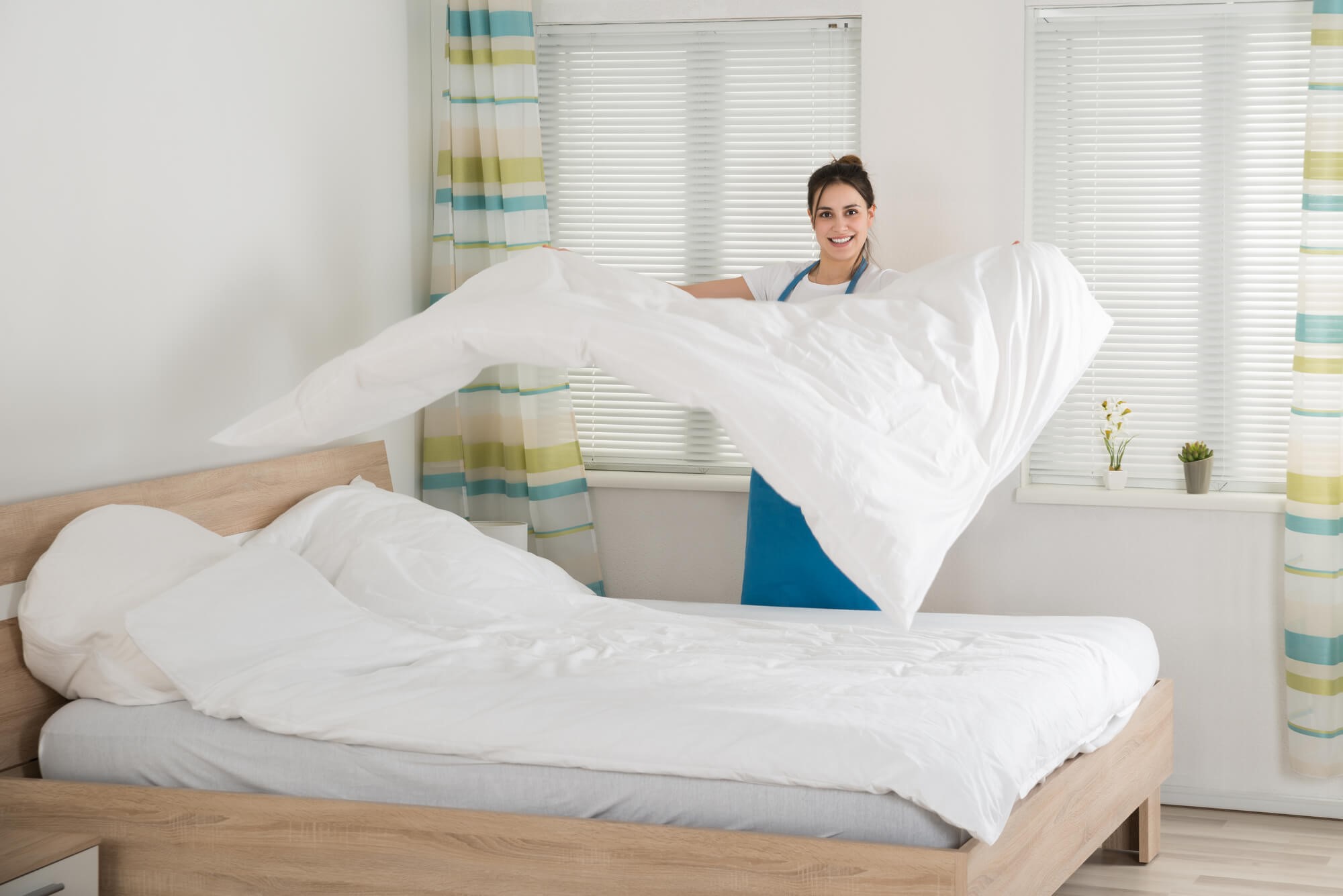 removing a heavy foam mattress from a bed