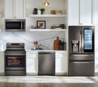 LG 4 Piece Kitchen Package with a 29.5 Cu. Ft. Capacity Smart French Door Craft Ice™ Refrigerator PLUS a FREE 5.8 cu. ft. Upright Freezer OR 6.9 cu. ft. All-Refrigerator! 