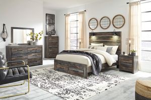 Signature Design by Ashley® Drystan Brown 3pc Queen Panel Bed with Storage Footboard Bedroom P97784986