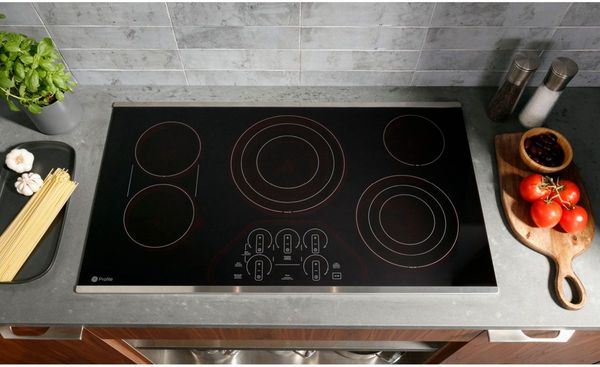 Kitchen Featuring a GE Profile™ 36" Black/Stainless Steel Built-In Electric Cooktop