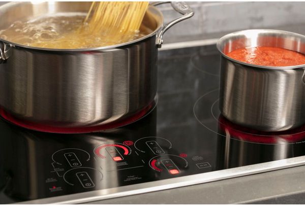 Kitchen featuring a GE Profile™ 30" Stainless Steel/Black Built-In Electric Cooktop