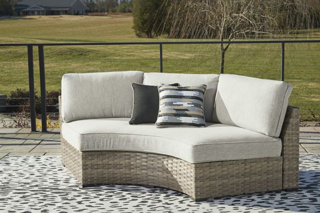 Signature Design by Ashley® Calworth Beige Outdoor Curved Loveseat-3