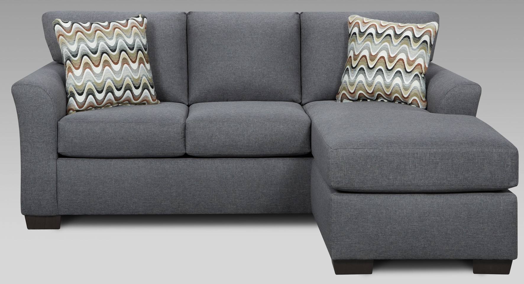 front view of a grey l-shaped sleeper sofa with two pillows