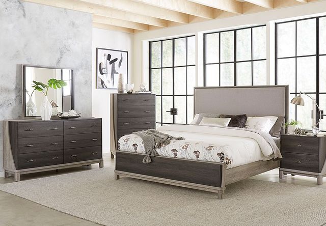 modern bedroom with queen size panel bed, matching dark grey wooden dresser and nightstand, with white walls and a marble accent wall